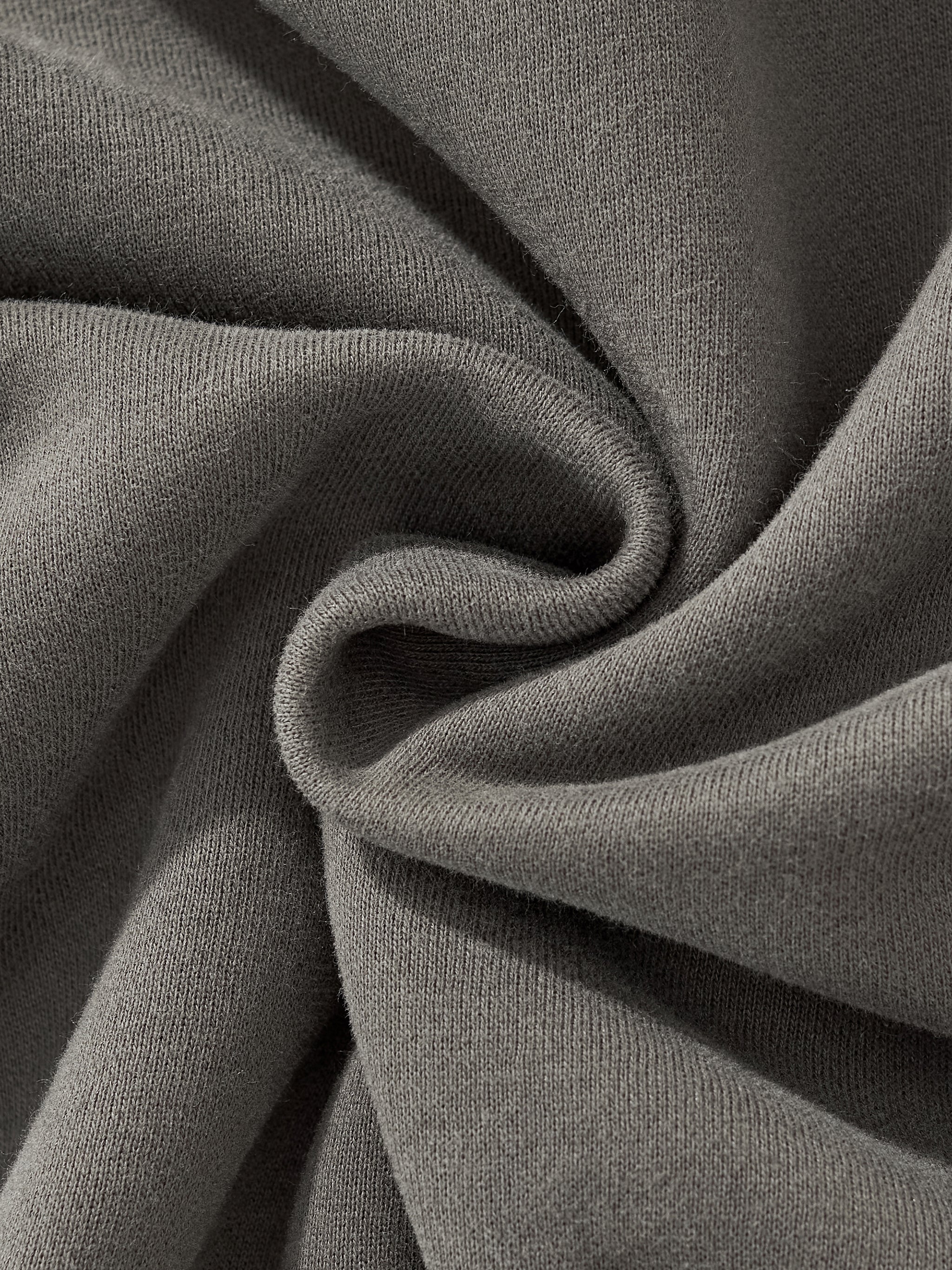 Close-up of soft, gray fleece fabric highlighting the premium texture for the Crossxnails Fleeced Boxy Hoodie.