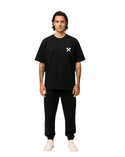 Model wearing Crossxnails oversized black t-shirt and joggers, showcasing Christian streetwear from Ipswich, UK.