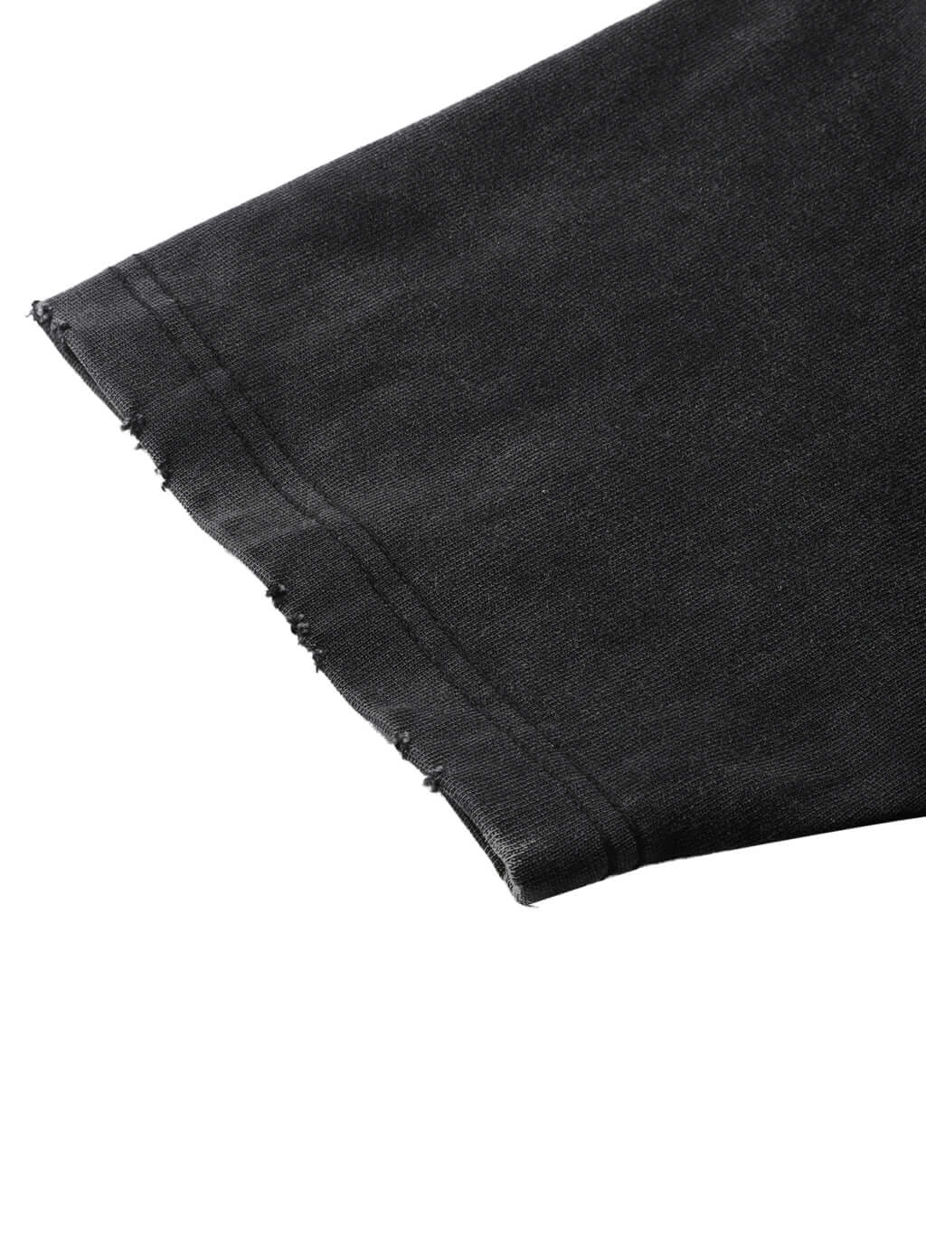 Close-up of the frayed hem of the Crossxnails Heavyweight T-Shirt, a premium oversized tee made from organic cotton.