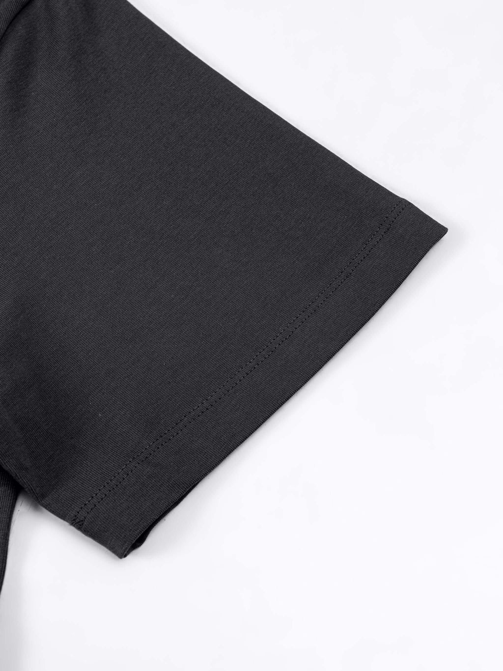 Close-up of Crossxnails Oversized T-Shirt sleeve in dark grey, 100% organic cotton, UK streetwear essential.