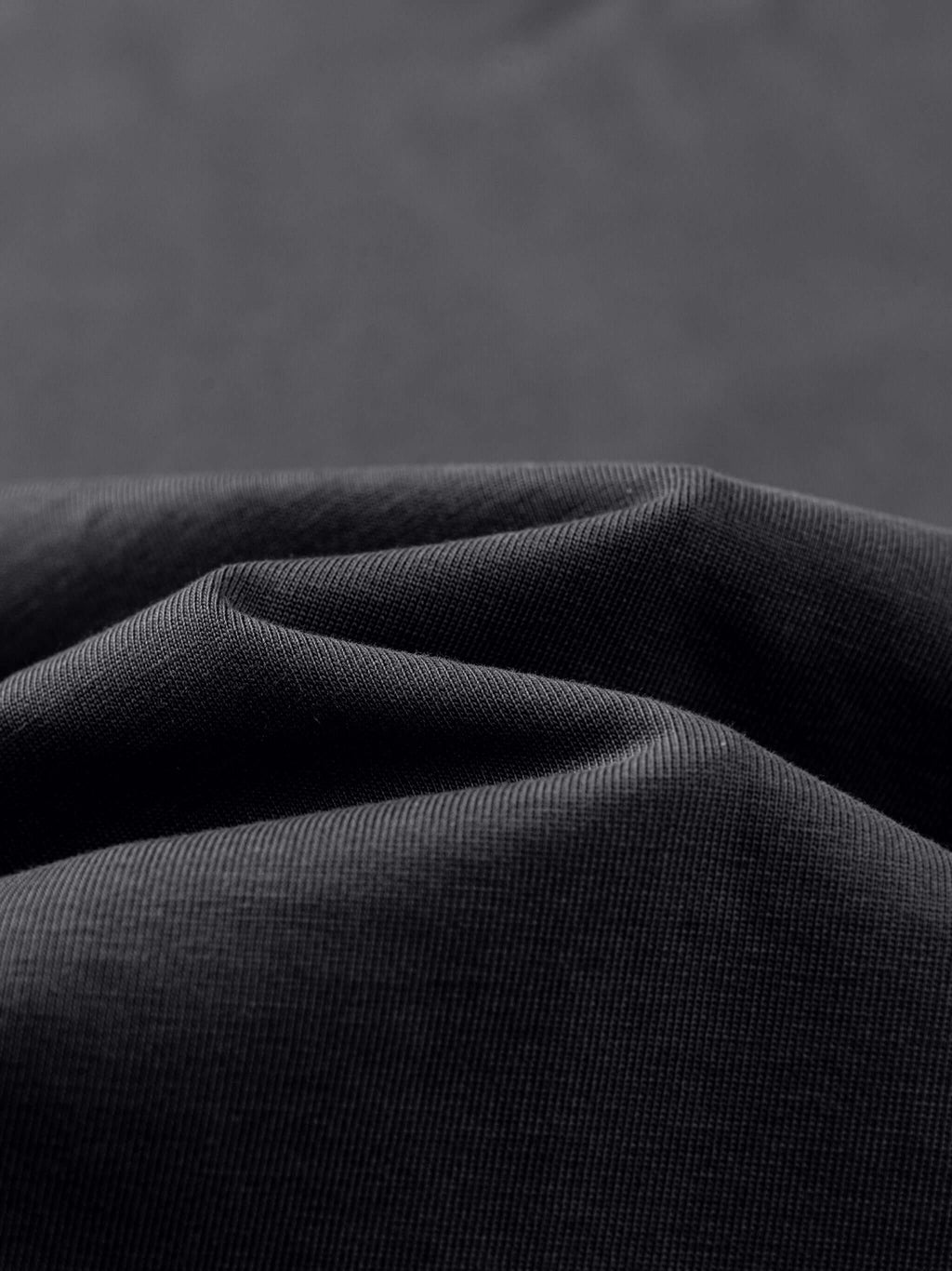 Close-up of premium 100% cotton fabric showcasing soft texture for Crossxnails oversized t-shirt, perfect for streetwear in UK and US.