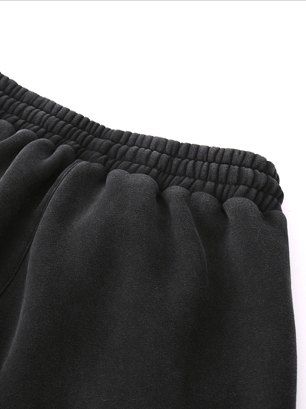 Close-up of Crossxnails Fleeced Jogger Sweatpants waistband, premium cotton blend, relaxed fit, streetwear for UK and LA.