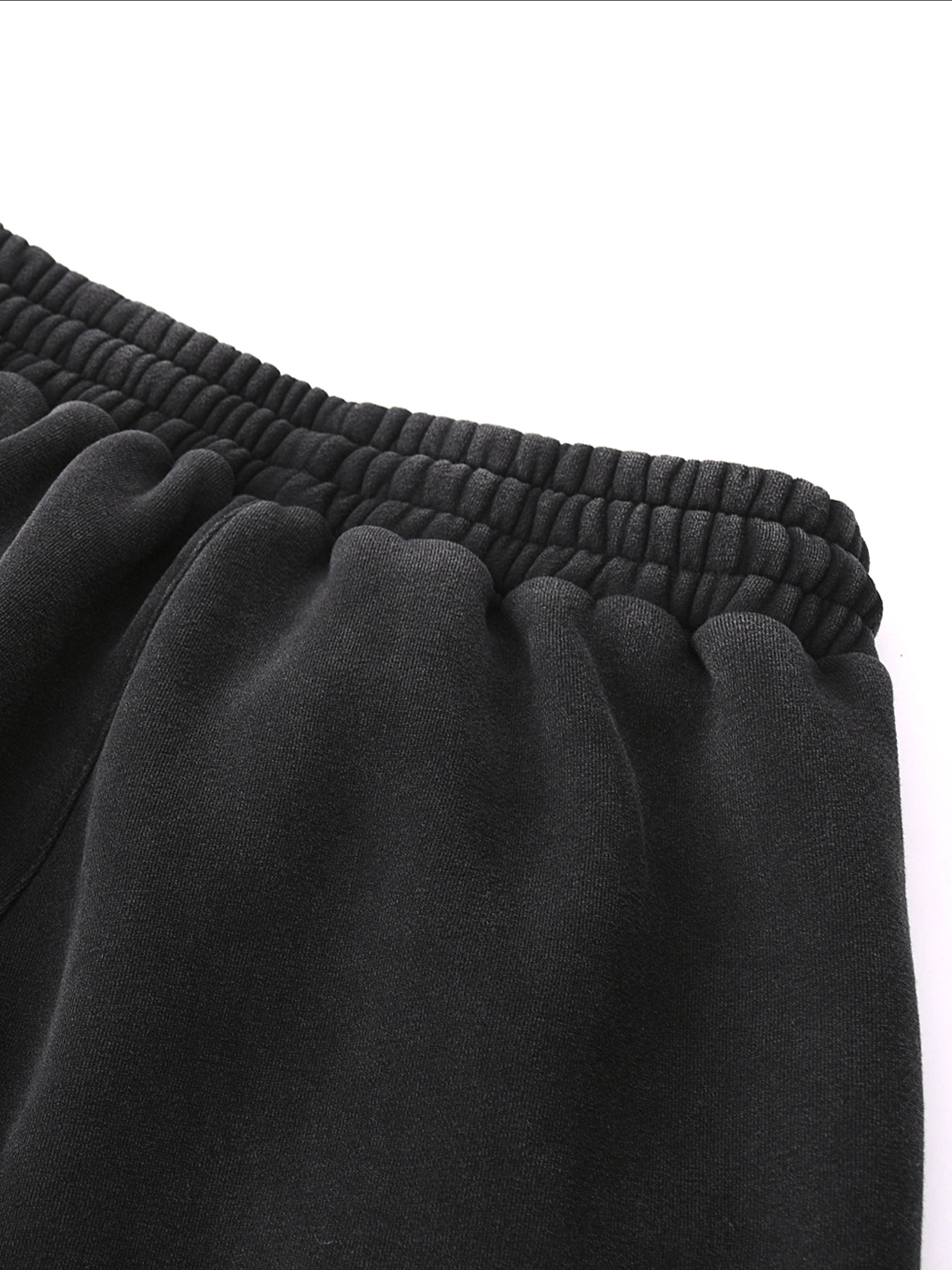 Close-up of Crossxnails Fleeced Jogger Sweatpants waistband, premium cotton blend, relaxed fit, streetwear for UK and LA.