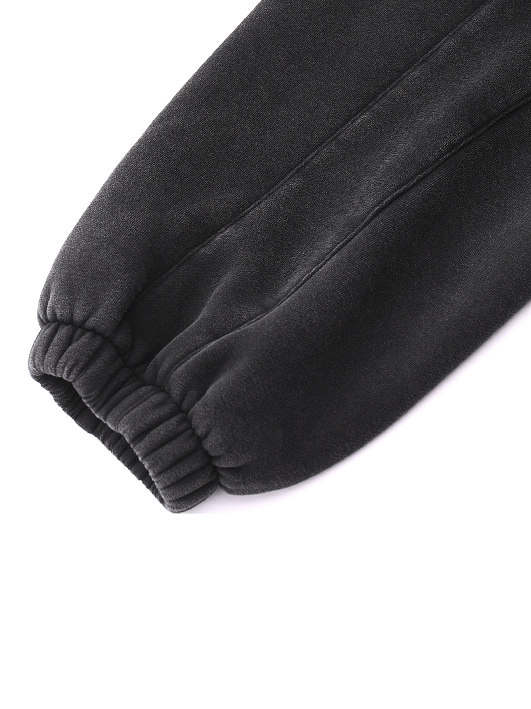 Close-up of Crossxnails Fleeced Jogger Sweatpants, premium cotton blend, relaxed fit, UK streetwear design.