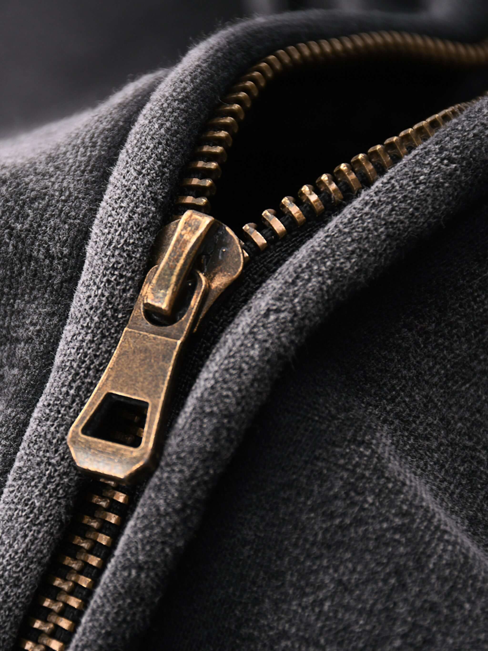 Close-up of Crossxnails Zip-Up Boxy Hoodie zipper, showcasing the vintage-washed texture and heavyweight fleece fabric.