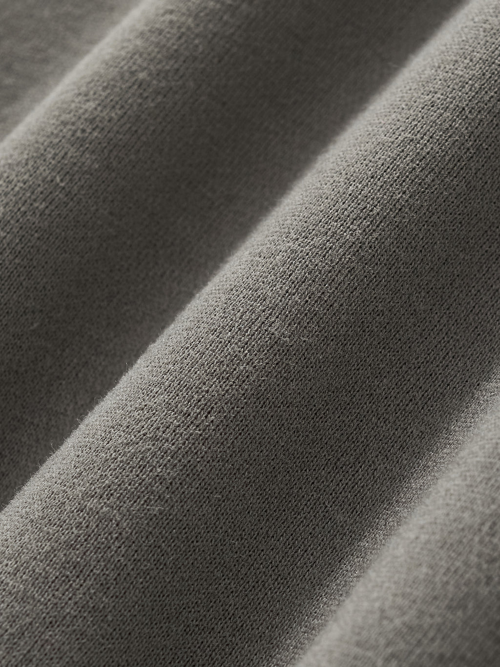 Close-up of soft, fleeced fabric showcasing texture and premium quality for Crossxnails Fleeced Boxy Hoodie.