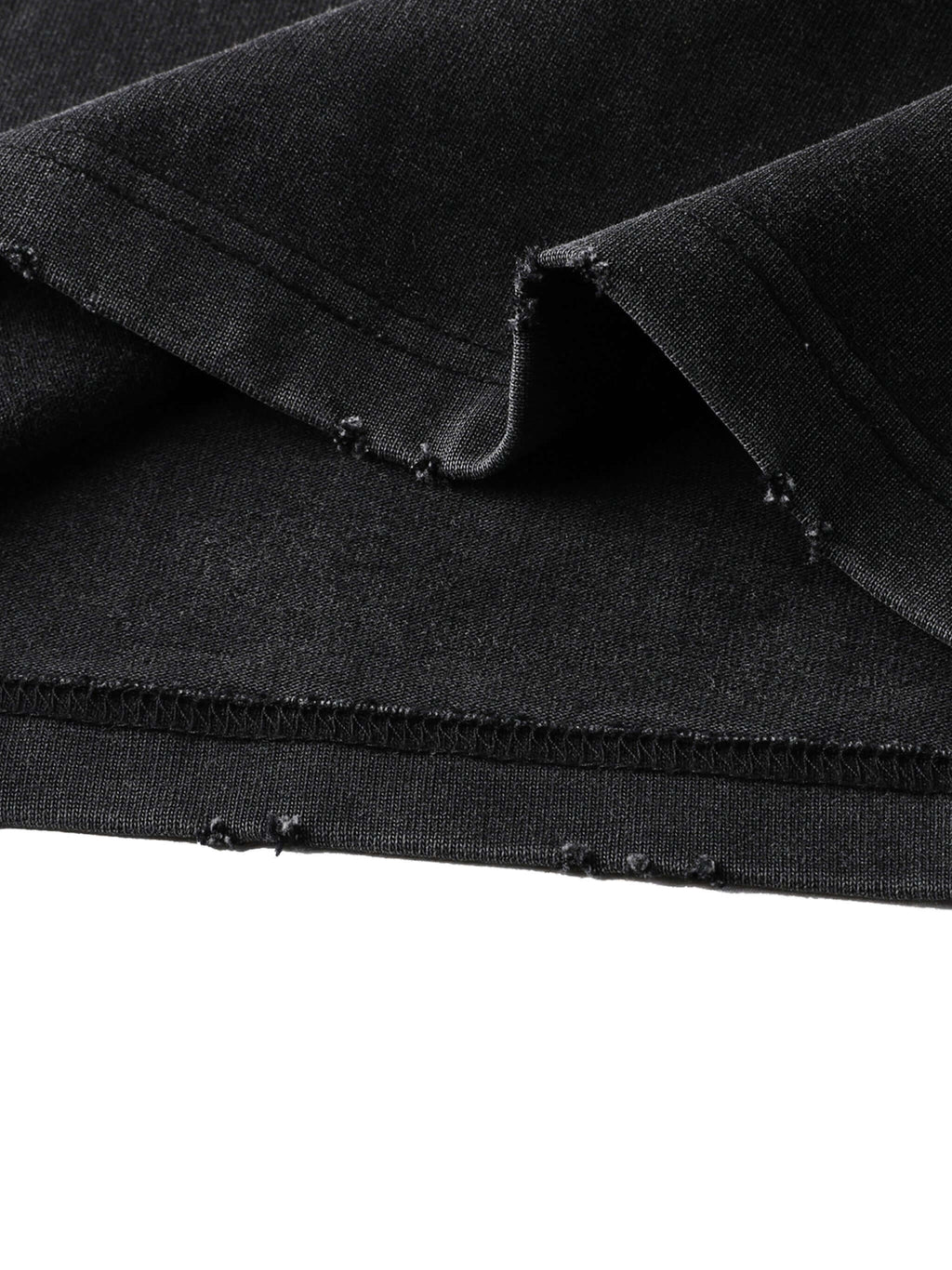 Close-up of Crossxnails® heavyweight washed oversized t-shirt fabric, showing premium stitching and quality in black.