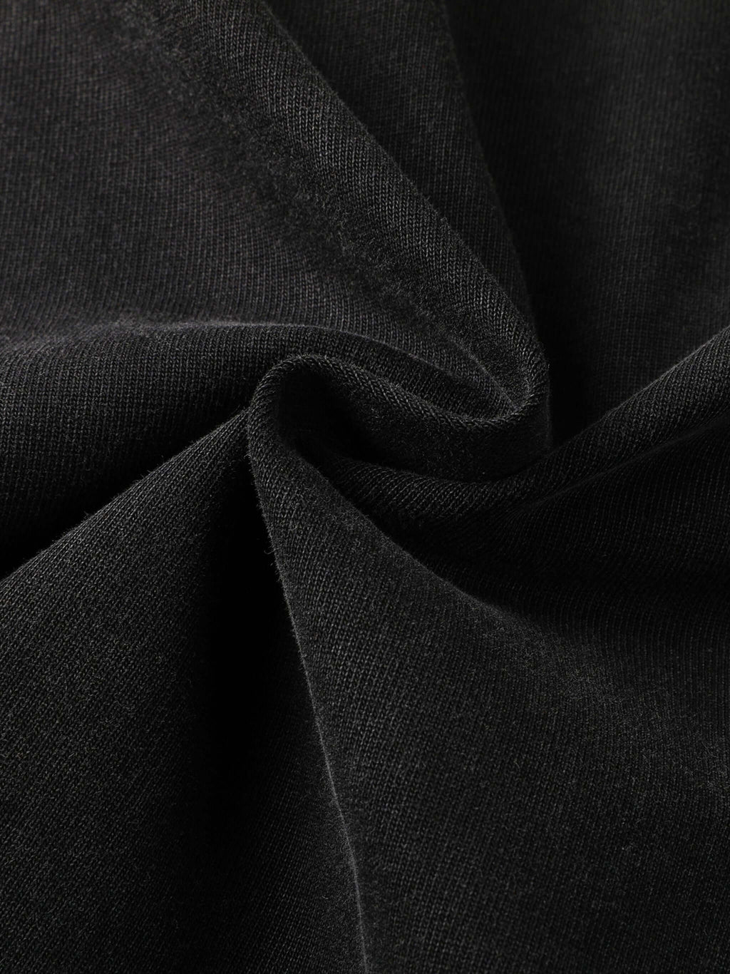 Close-up of premium 430gsm black cotton fabric showcasing texture for Crossxnails® oversized t-shirt, ideal for Christian streetwear.